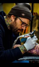 Cam West, from Living Skin Tattoo’s website