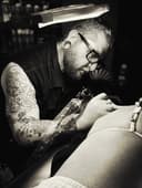 Kyle tattooing